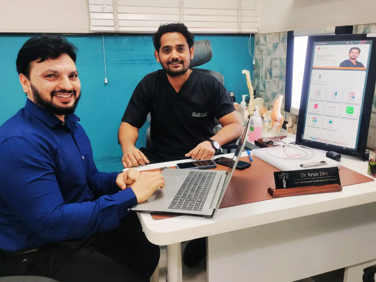 Dr. Arun Dev's consultation room with a digital display
