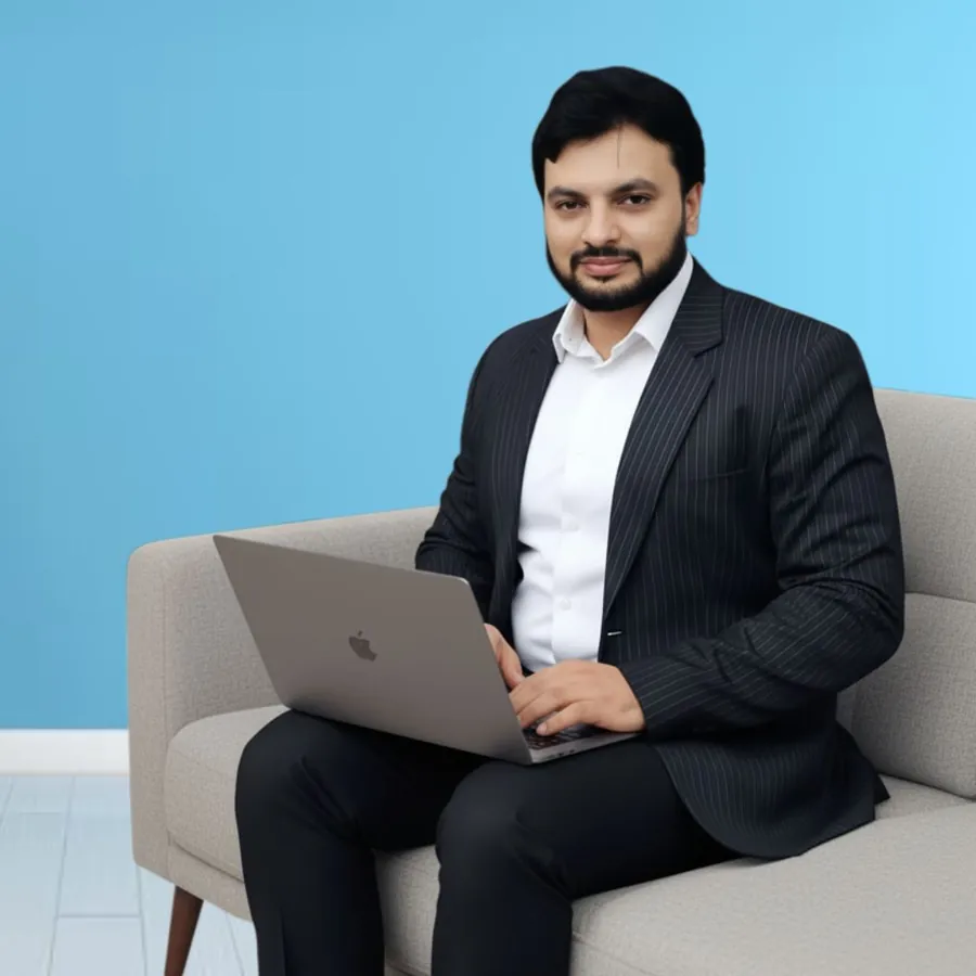 Syed Nyamathullah, founder of Hospital Success, working on a laptop
